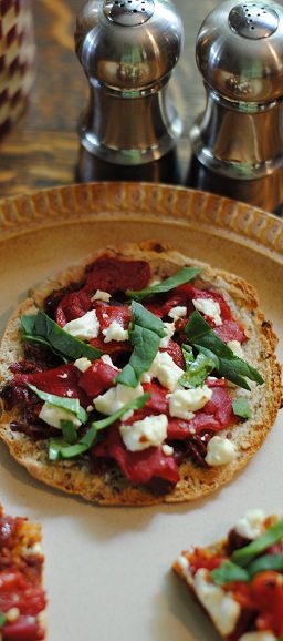 Goat cheese and sun dried tomato pita crisps